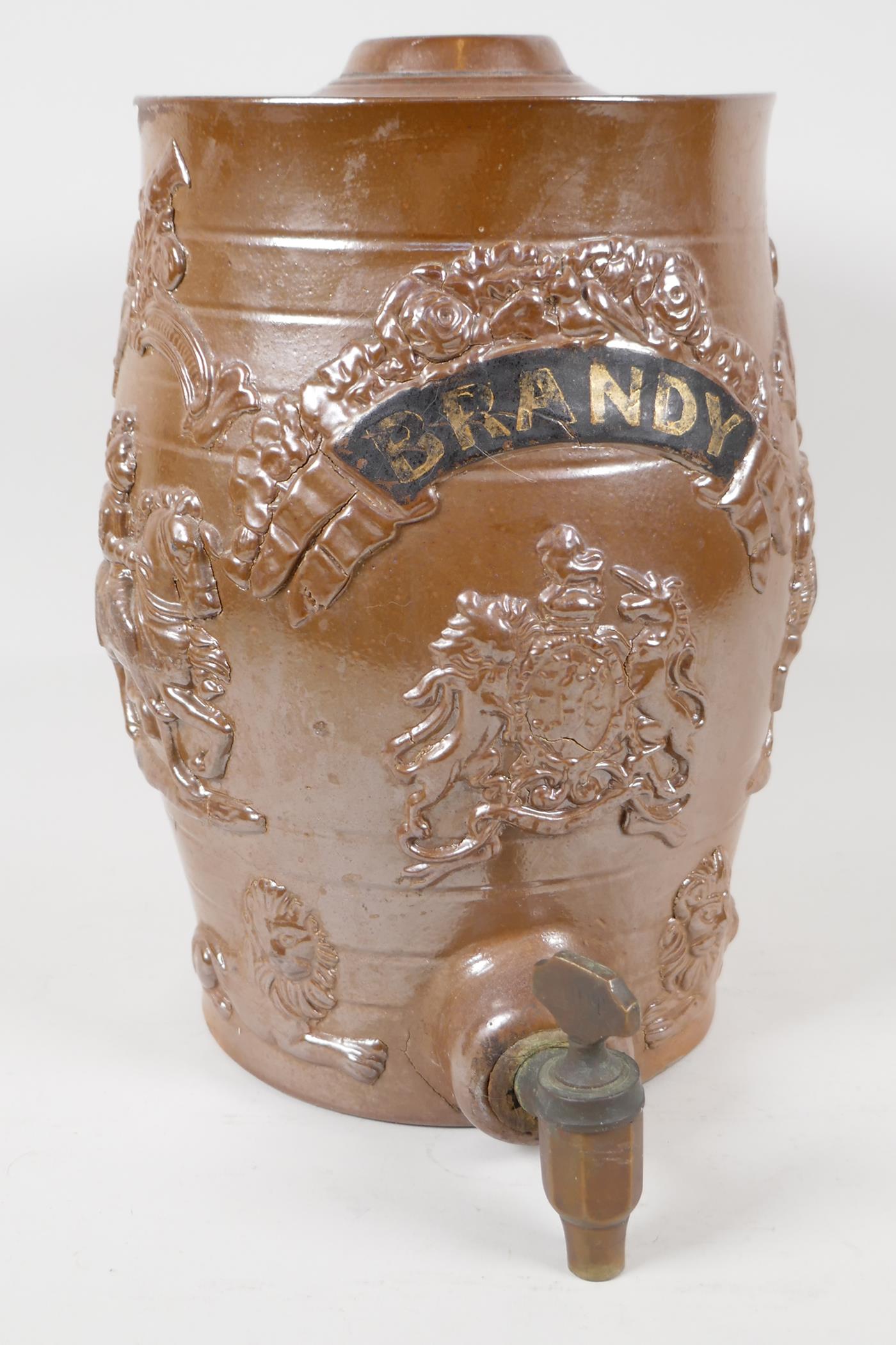 A C19th salt glazed stoneware brandy barrell, embossed with figures of knights on horseback, lions