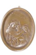 An embossed oval bronze plaque, depicting 'The Madonna, Jesus and St John, 5" x 6"