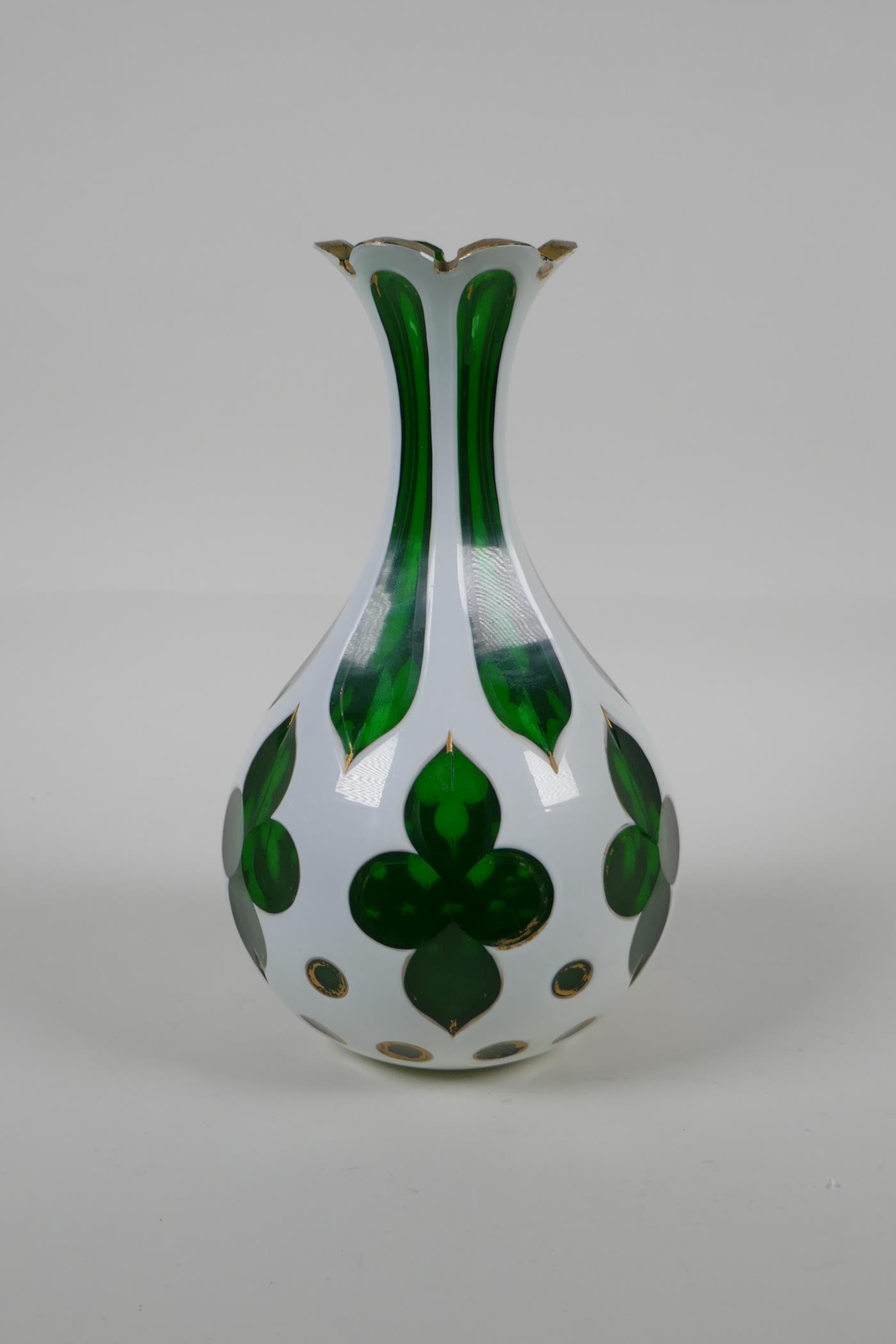A Bohemian overlaid green glass vase with gilt details, 8½" high
