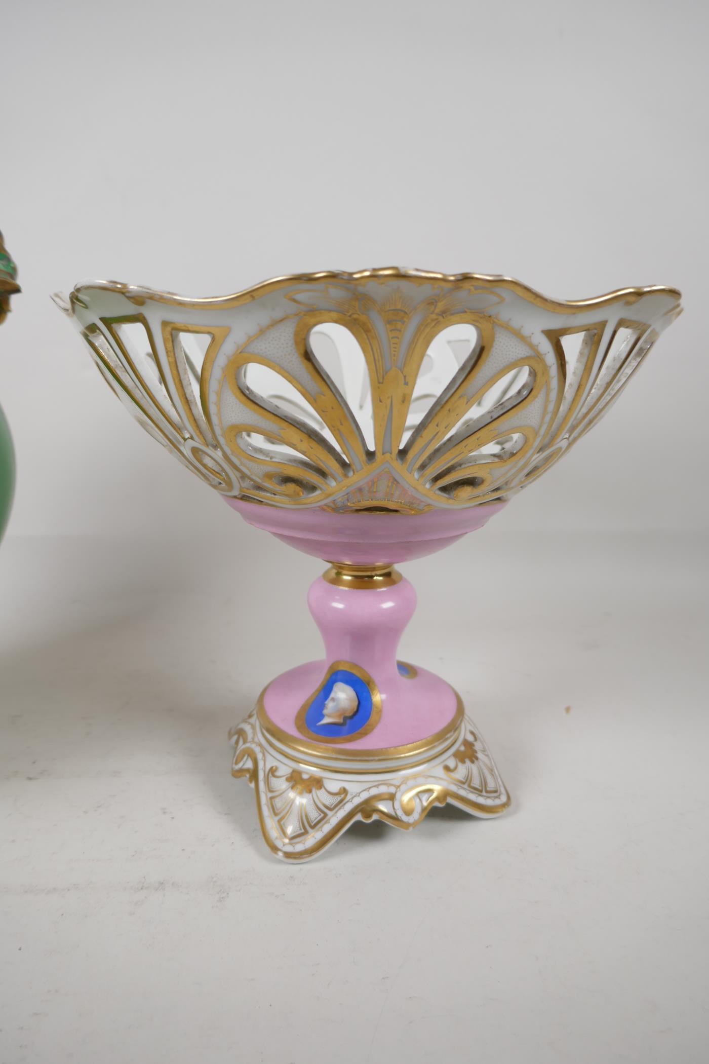 A C19th European porcelain lidded two handled jar and cover, Painted with flowers raised on four - Image 2 of 4