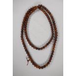 A Tibetan horn mala bead necklace, 60" long