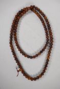 A Tibetan horn mala bead necklace, 60" long