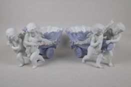 A pair of Parian ware table centrepiece bowls, in the form of cherubs pulling shell carts. 12" long