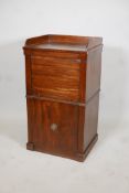 An antique mahogany side cabinet with galleried top and tambour front over a deep drawer, 19" x