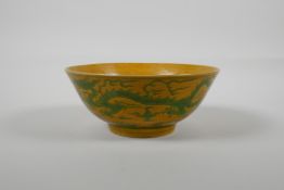 A Chinese yellow & green glazed porcelain bowl, with incised dragon decoration, Ming 6 character