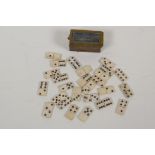 A miniature brass box containing twenty six bone dominoes, dominoes ¾" long