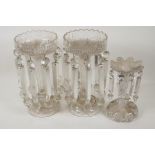 A pair of C19th clear glass table lustres (1 drop missing), 12½" high, and another smaller lustre (1