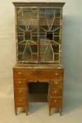 An C18th mahogany kneehole desk with associated astragal glazed top, A/F, 18" x 30" x 68"