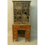 An C18th mahogany kneehole desk with associated astragal glazed top, A/F, 18" x 30" x 68"