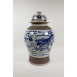 A Chinese blue and white crackleware Meiping jar and cover, decorated with dragons chasing the