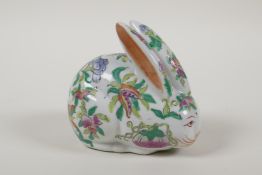 A Chinese polychrome enamelled porcelain rabbit decorated with flowers and fruit, 4 character mark