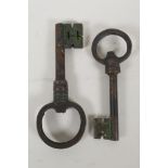 Two oversized metal keys, largest 9½"