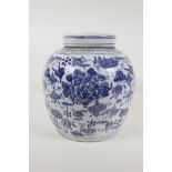 An early C20th Chinese porcelain ginger jar and cover, with floral decoration, 9½" high