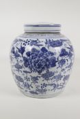 An early C20th Chinese porcelain ginger jar and cover, with floral decoration, 9½" high