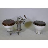 Two vintage porcelain sea toilets by Blake & Sons of Gosport, one with an attached period pump