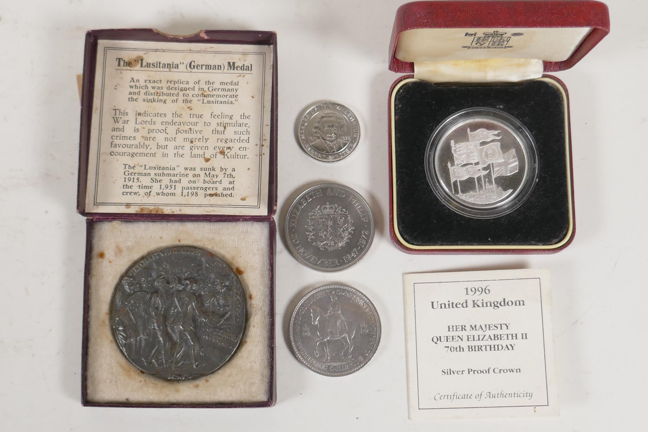 A £5 silver proof coin, in case with C.O.A., two Elizabeth II Crowns and a Lusitania medal in box