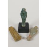 Two Egyptian turquoise glazed faience shabtis, together with a pottery token in the form of a seated