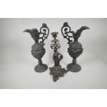 A spelter candlestick cast as a classical muse, 13" high, and a pair of ornamental spelter ewers
