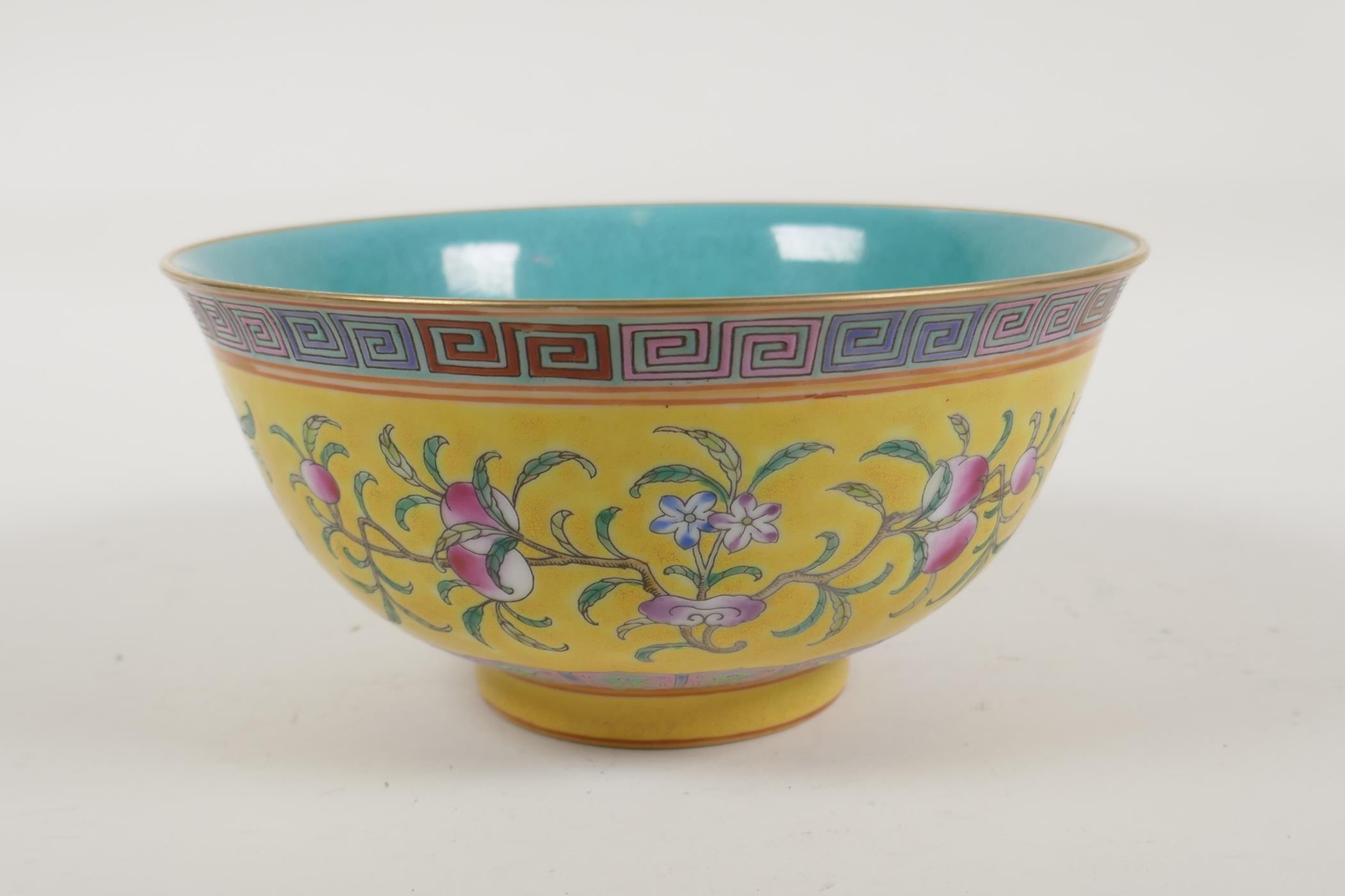 A Chinese yellow and turquoise ground porcelain rice bowl with famille rose enamelled peach tree - Image 2 of 6