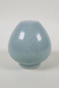 A celadon glazed porcelain squat vase with incised decoration, Chinese Qianlong seal mark to base,