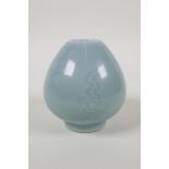 A celadon glazed porcelain squat vase with incised decoration, Chinese Qianlong seal mark to base,