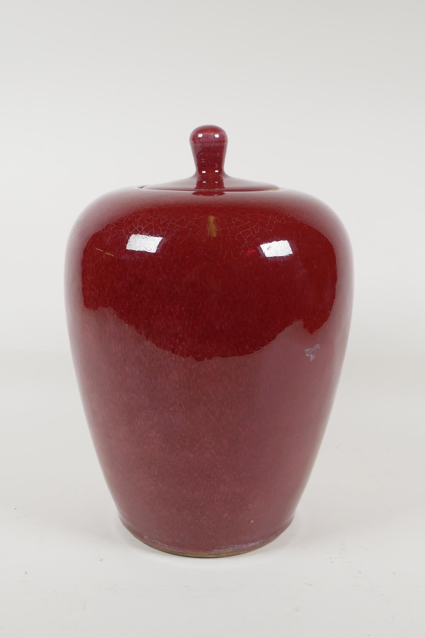 A Chinese iron red glazed porcelain jar and cover, 10½" high - Image 3 of 4