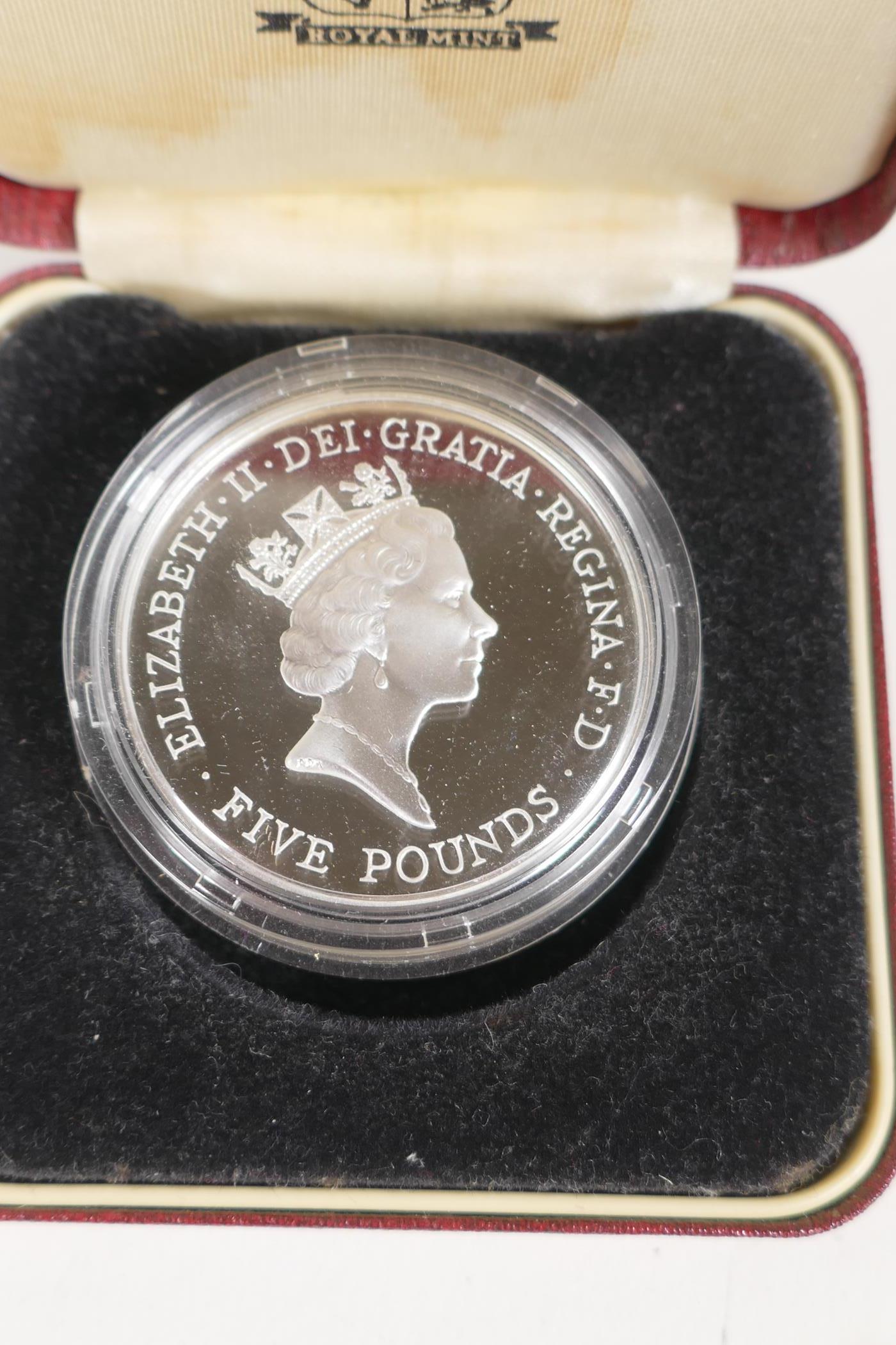 A £5 silver proof coin, in case with C.O.A., two Elizabeth II Crowns and a Lusitania medal in box - Image 8 of 8