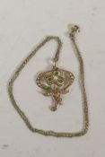 A 14ct gold seed pearl and emerald pendant on a delicate gold chain, gross 5.8g