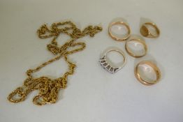 Four 9ct gold rings, 8.5g, a 9ct gold ring set with five white stones, 1.9g, and a 9ct gold chain,