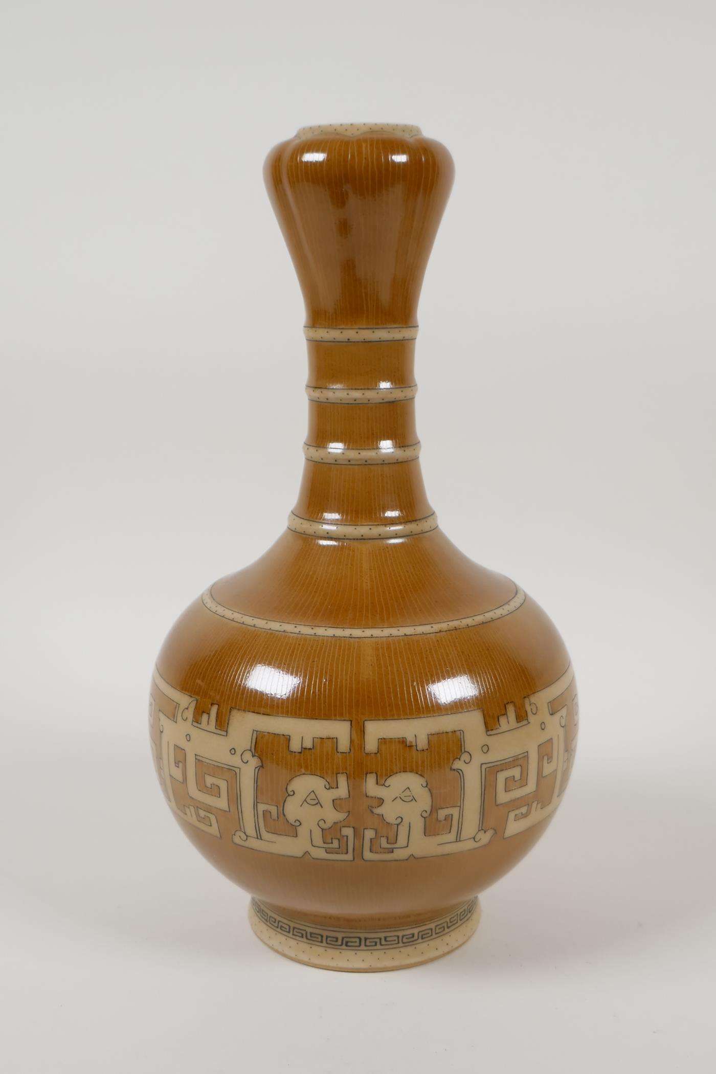 A Chinese garlic head shaped porcelain vase with a bamboo style glaze, and archaic decoration,