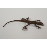 A Japanese bronze okimono in the form of a lizard, 6½" long