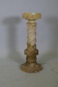 An alabaster torchere/stand with dished top, 28" high