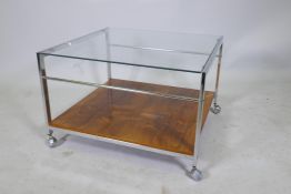 A mid century Howard Miller MDA two tier occasional table, with glass top and rosewood veneered