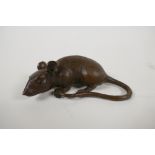 A Japanese bronze okimono in the form of a rat, impressed seal mark to base, 3½" long