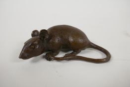 A Japanese bronze okimono in the form of a rat, impressed seal mark to base, 3½" long