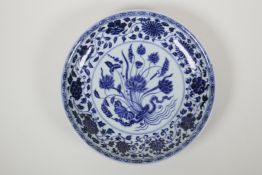 A Chinese blue and white porcelain charger with floral decoration, 6 character mark to base, 11"