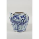 A Chinese blue and white porcelain pourer with four lug handles, decorated with a landscape scene