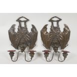 A pair of bronze Gothic style two branch wall sconces in the form of vampire bats, 13½" long