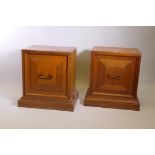 A pair of Younger mahogany pedestal cabinets, with moulded doors and plinth bases, 28" x 20" x 28"