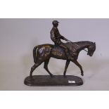 After O. Tupton, cold cast bronzed figure of a jockey and mount, 14½" high