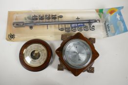A vintage carved oak cased barometer, 7" wide, a contemporary barometer by Woodford, and a German