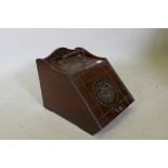 A Victorian mahogany and brass mounted coal scuttle with carved decoration, 18" x 13" x 13"