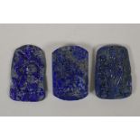 Three Chinese lapiz lazuli pendants with carved decoration of immortals and ruyis, 1½" x 2½"