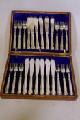 A Rodgers silver plated 12 place fish knife and fork service, in oak canteen