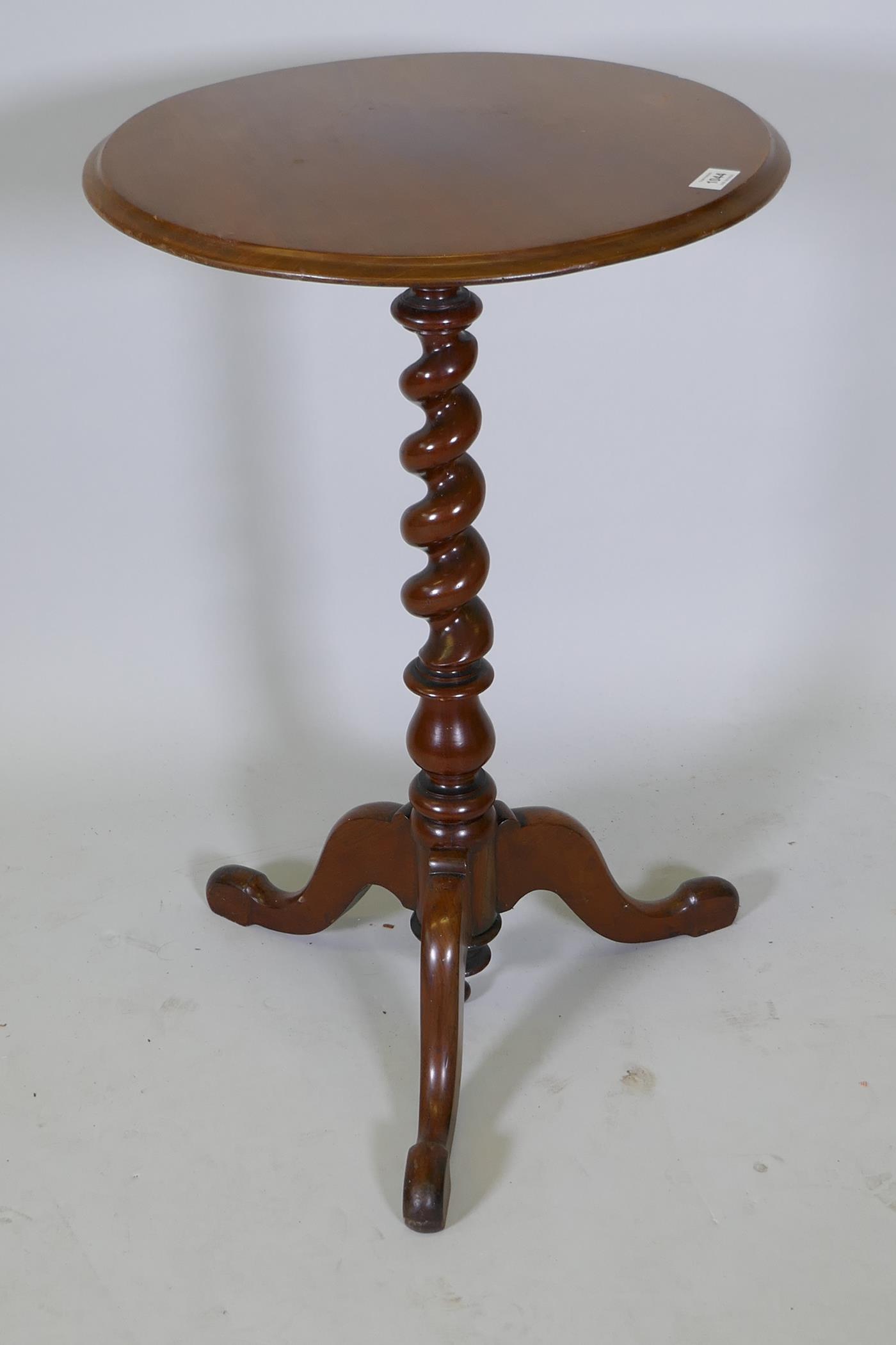 A C19th circular top mahogany occasional table on barley twist turned column and tripod base, 29½"