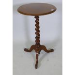 A C19th circular top mahogany occasional table on barley twist turned column and tripod base, 29½"