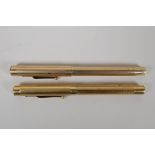 Two gold plated 'Swan' Mabie Todd fountain pens, one USA made and one England made, both with 14ct