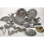 A quantity of antique and oriental pewter wares including oil lamp, quaich, tappet, spoons etc