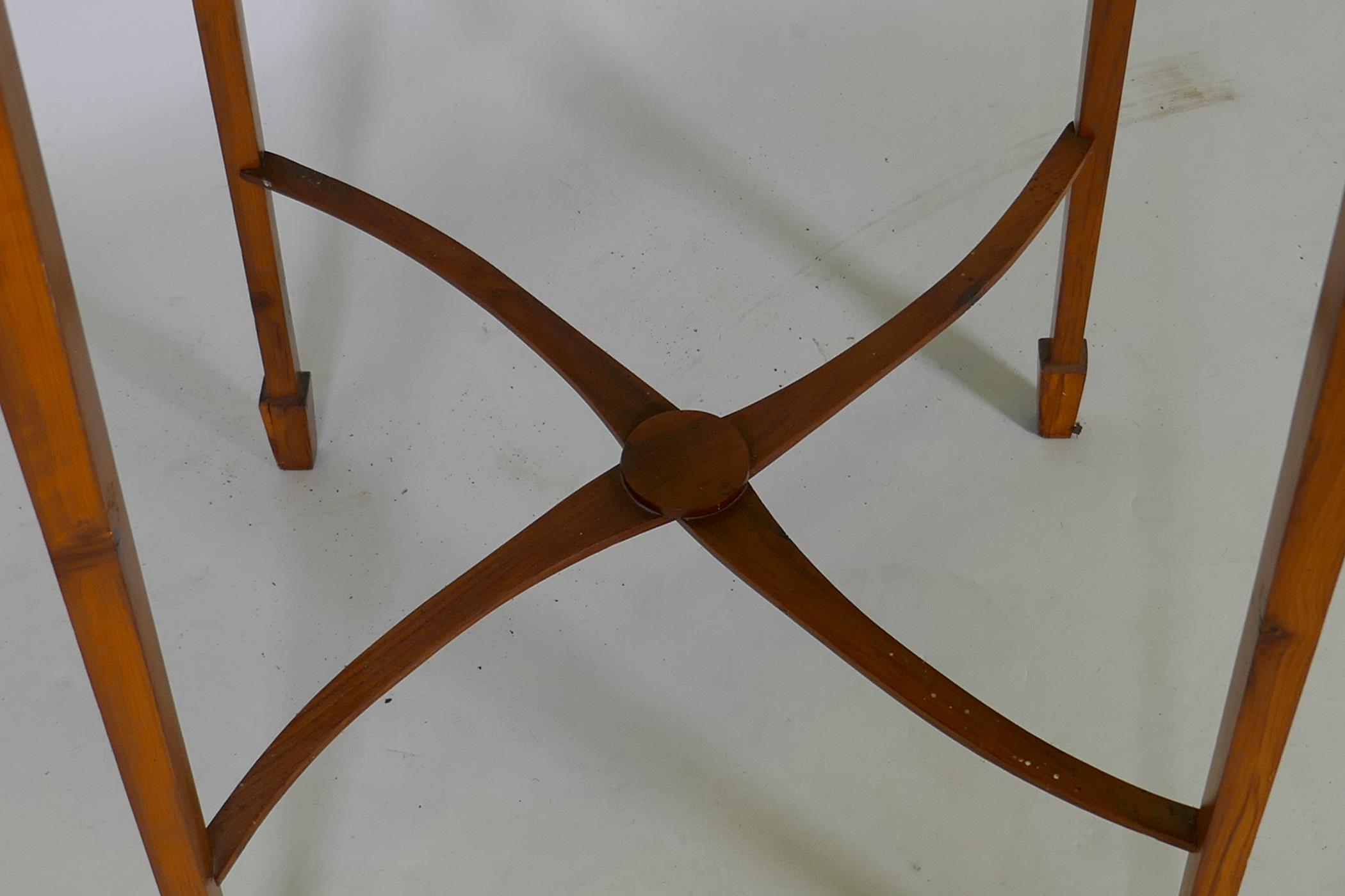 A mid C20th bespoke yew wood lamp table, raised on slender tapering supports united by shaped - Image 3 of 3