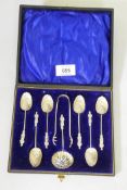 A set of six silver apostle spoons with strainers, silver plated tongs, Birmingham 1896, 48g